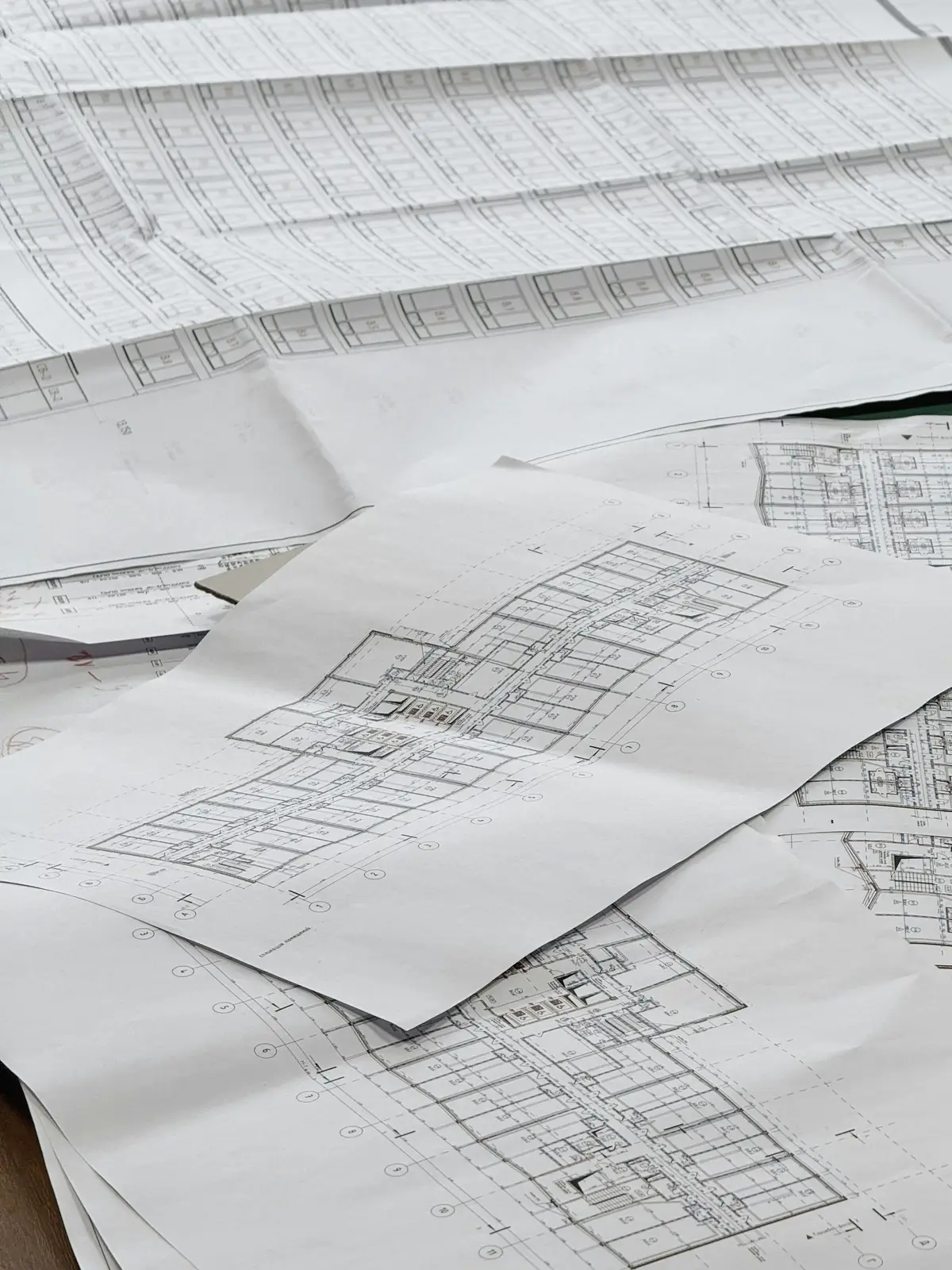 Architectural drawings spread across a table