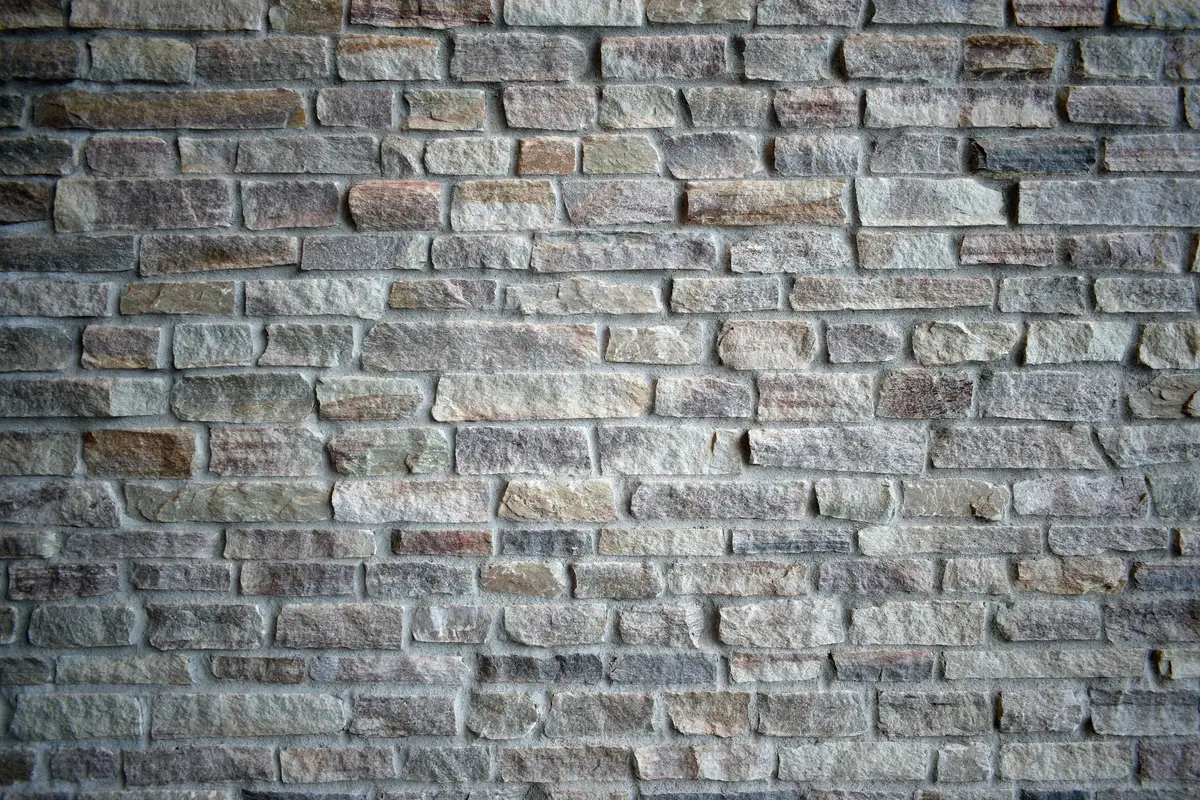 Grey and buff clay brick laid in a running bond