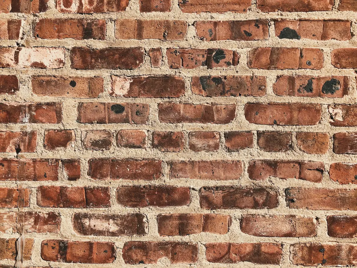 Close view of weathered red brick and mortar